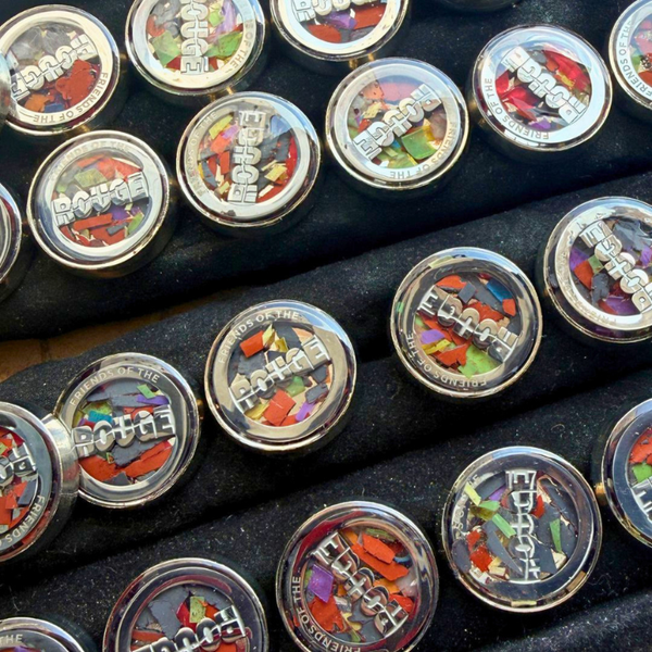 Finished Friends of the Rouge pins made from trash found during River Rouge cleanup efforts.