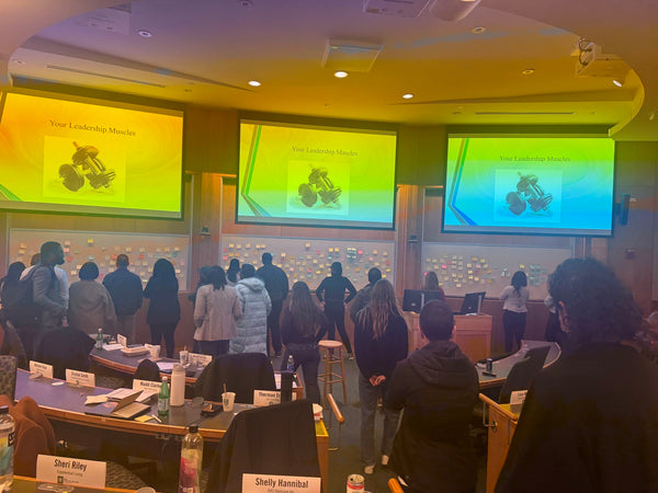 Students huddled around the notes during the exercise.