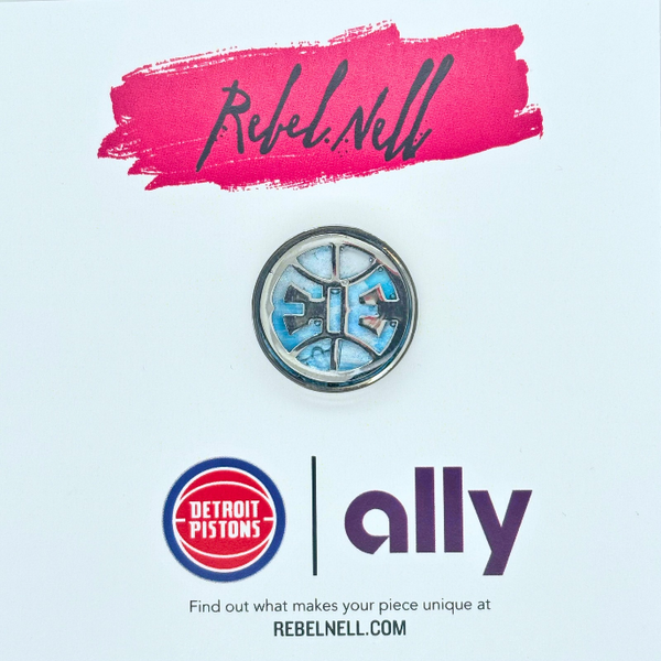 A finished She-313 pin with custom designed Rebel Nell x Ally Bank packaging.