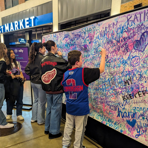 Pistons fans filling in the mural at Little Caesars Arena.